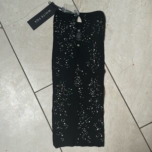 White fox black sparkly dress